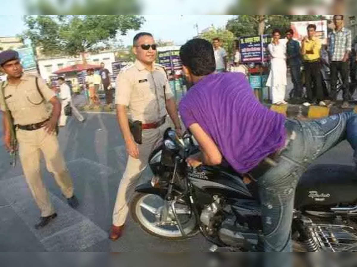 Shivdeep Lande standing in front of Laharriyakat motorcycle rider
