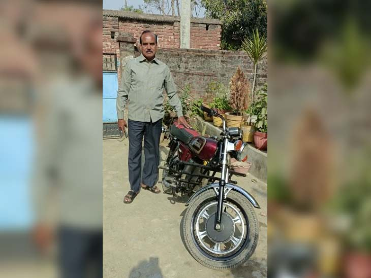 Kishore Singh with an e-bike made from junk