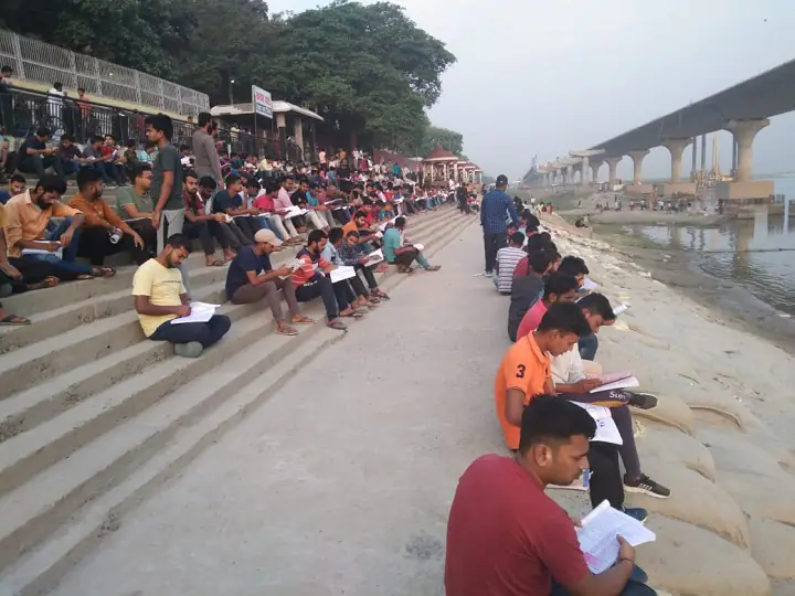 Youth enjoys studying at Ganga Ghat