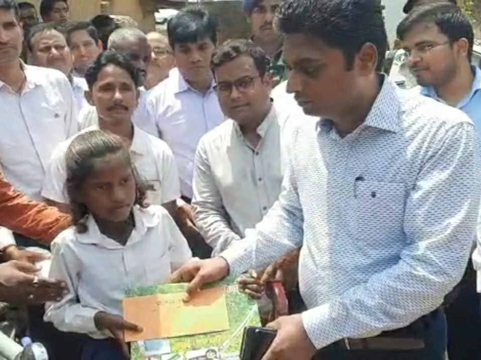 DM Avnish Kumar presented a tricycle to Seema to go to school