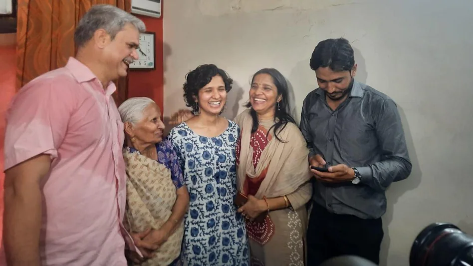 Topper Shruti Sharma with her family