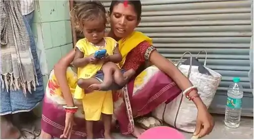 Two hands and two legs are attached to the waist part of a two and a half year old girl